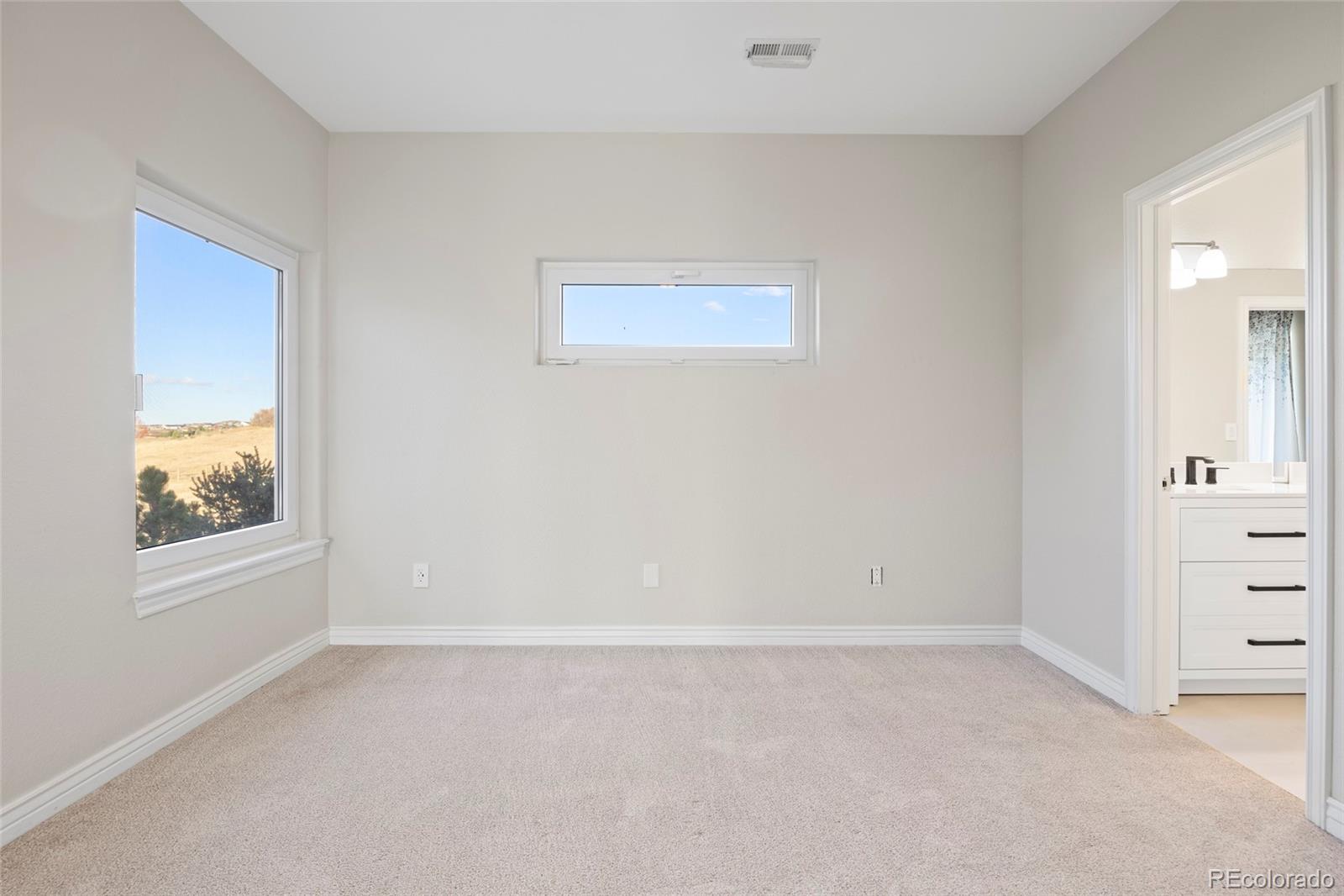 3532 Bell Mountain Drive Castle Rock, CO 80104 - Photo 29 of 50 an empty room with windows and closet