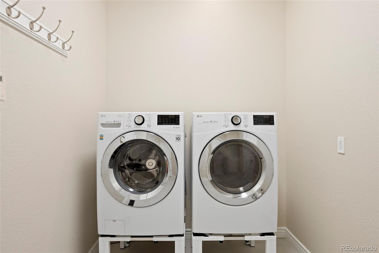 3532 Bell Mountain Drive Castle Rock, CO 80104 - Photo 40 of 50 a utility room with dryer and washer