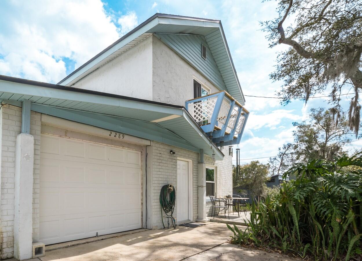 2289 Holder Road Mims, FL 32754 - Photo 1 of 17 a house with trees in front of it