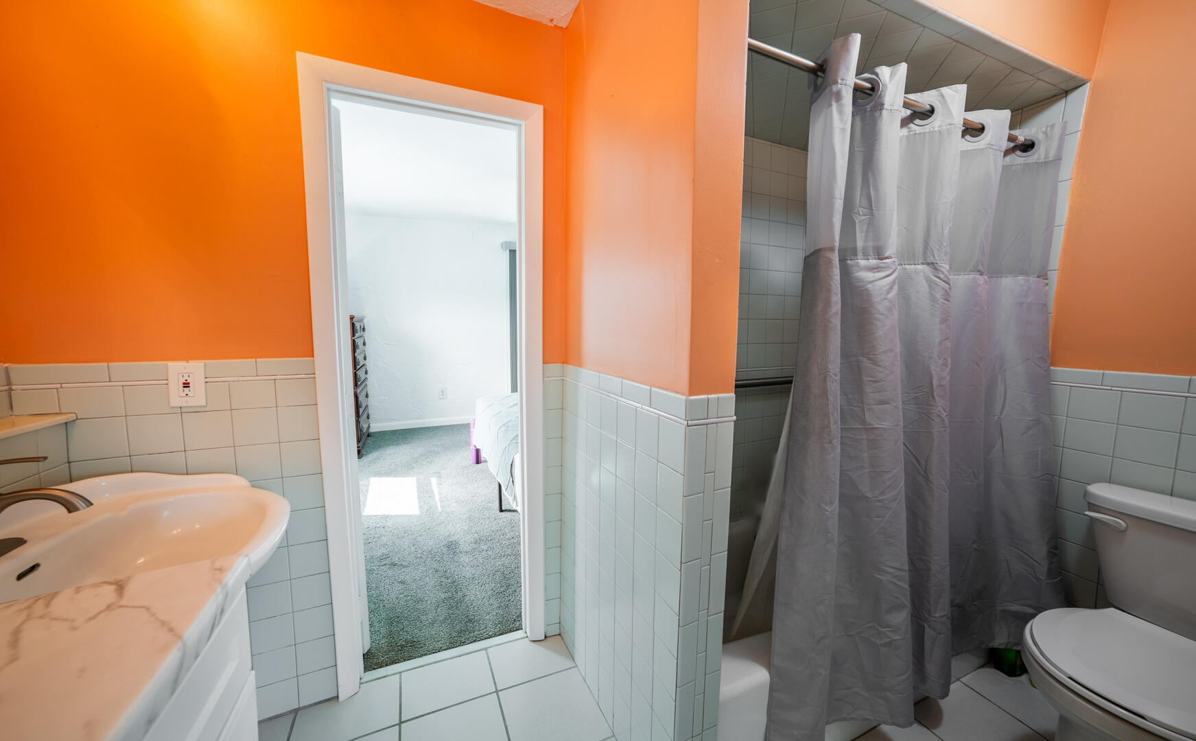 2289 Holder Road Mims, FL 32754 - Photo 12 of 17 a bathroom with a granite countertop shower and a sink