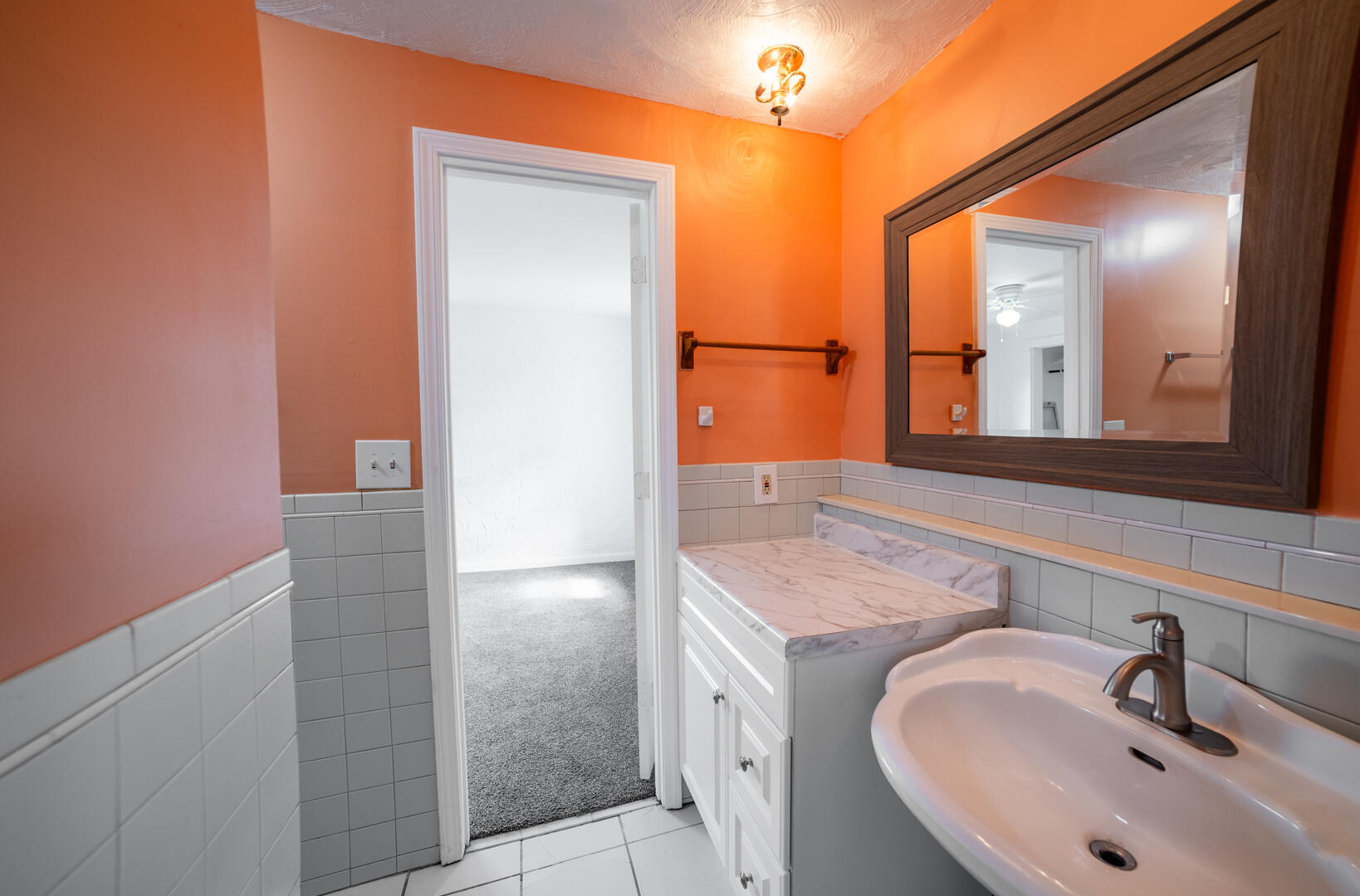 2289 Holder Road Mims, FL 32754 - Photo 13 of 17 a bathroom with a sink and a mirror