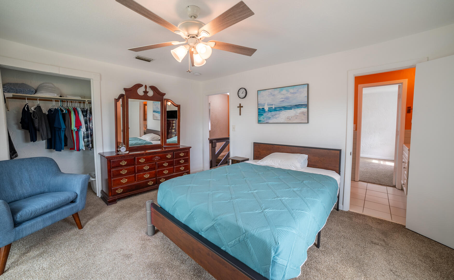2289 Holder Road Mims, FL 32754 - Photo 8 of 17 a bedroom with a bed and ceiling fan