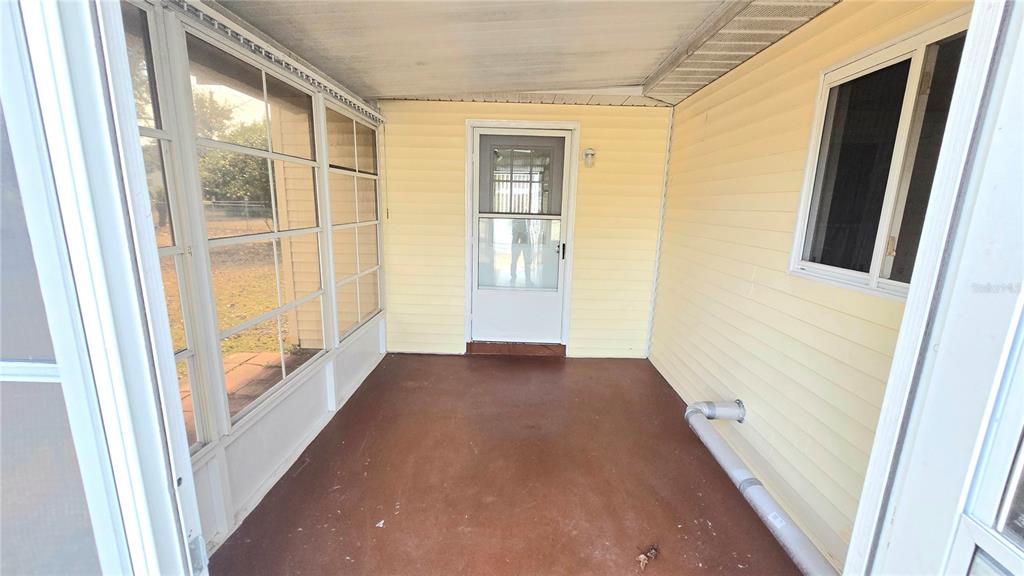 11239 Southwest 77th Court Ocala, FL 34476 - Photo 10 of 22 a view of an empty room with a window