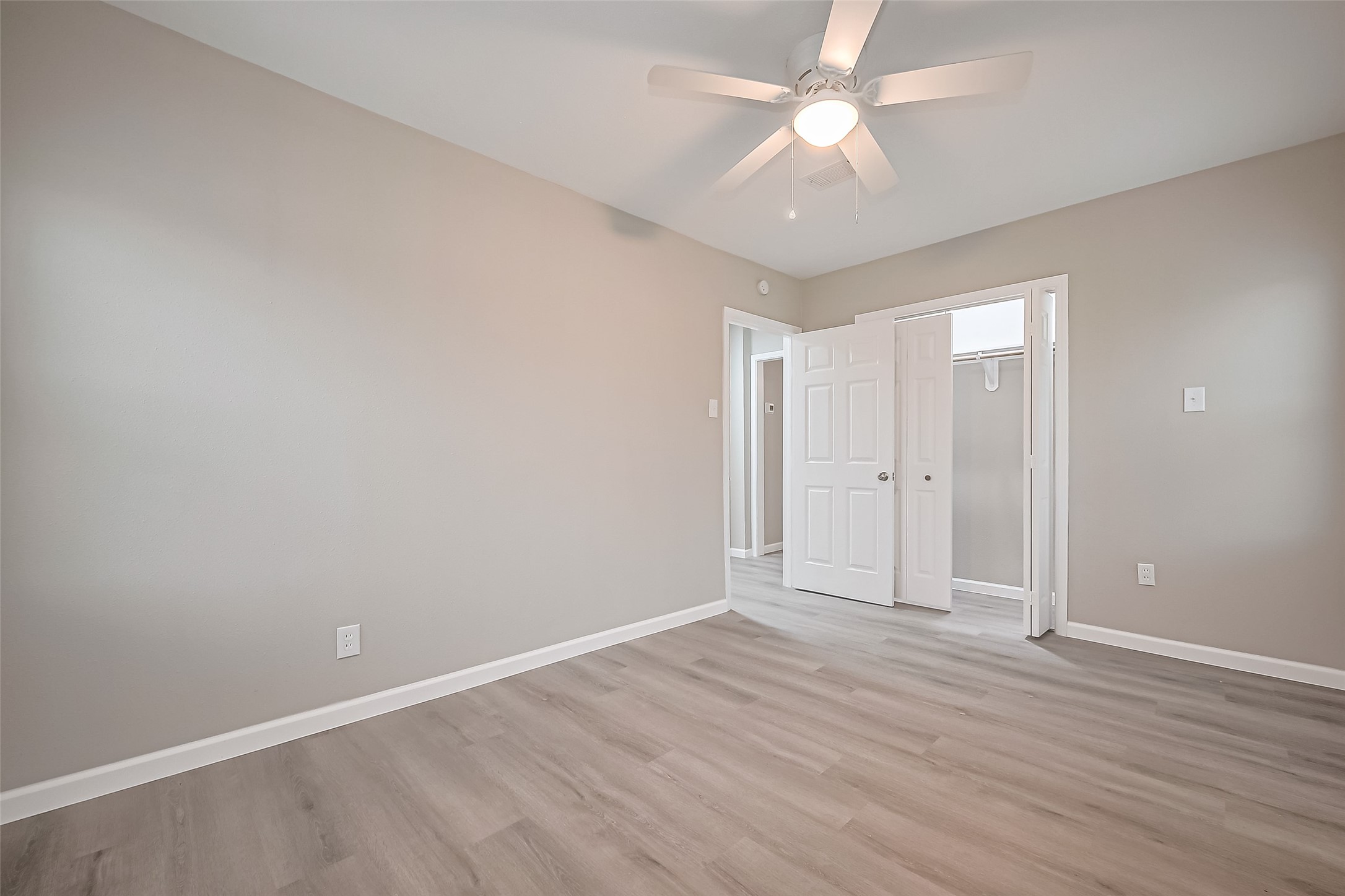 1739-17 West 5th Street Freeport, TX 77541 - Photo 16 of 26 wooden floor in an empty room