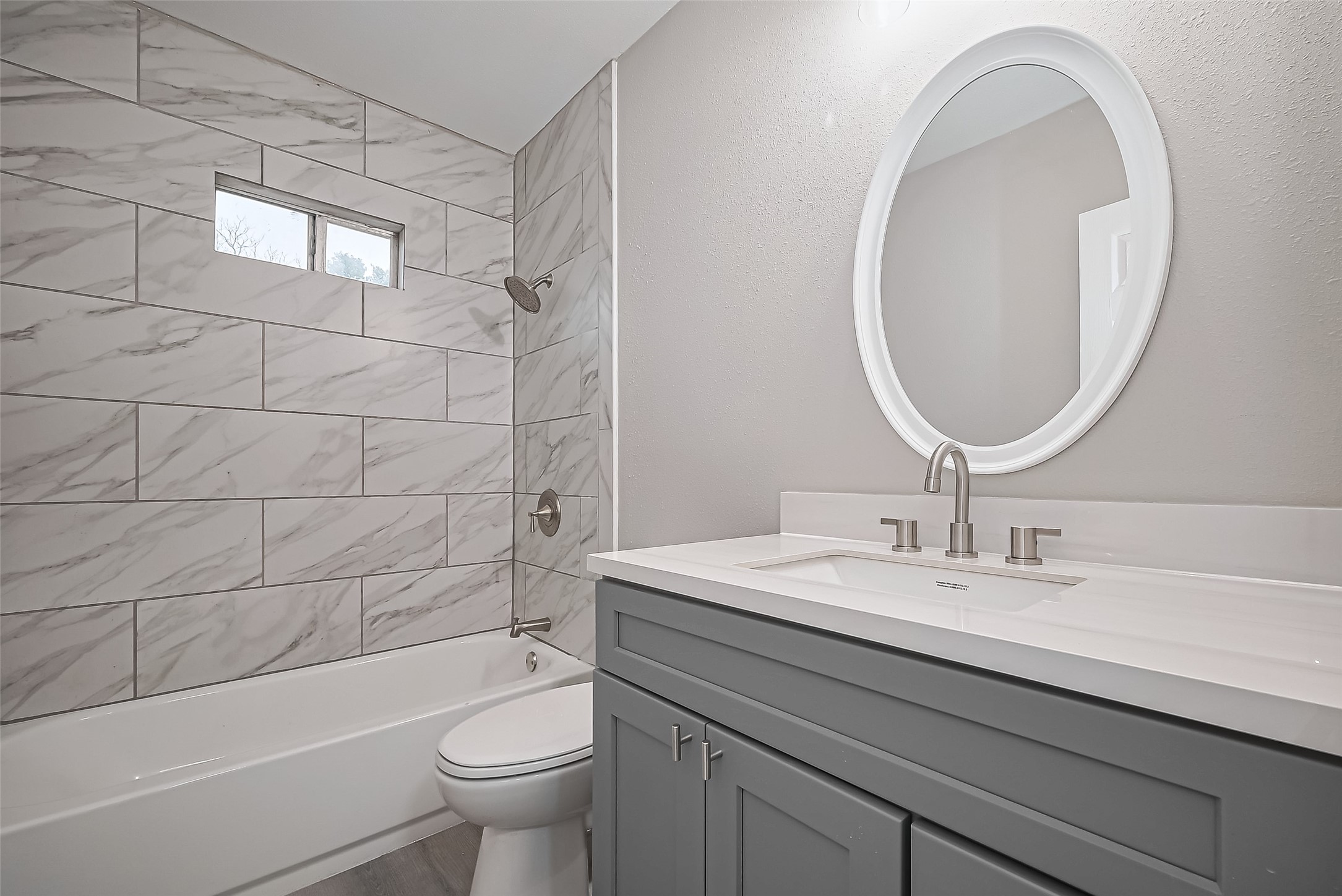 1739-17 West 5th Street Freeport, TX 77541 - Photo 19 of 26 a bathroom with a sink a toilet and a mirror