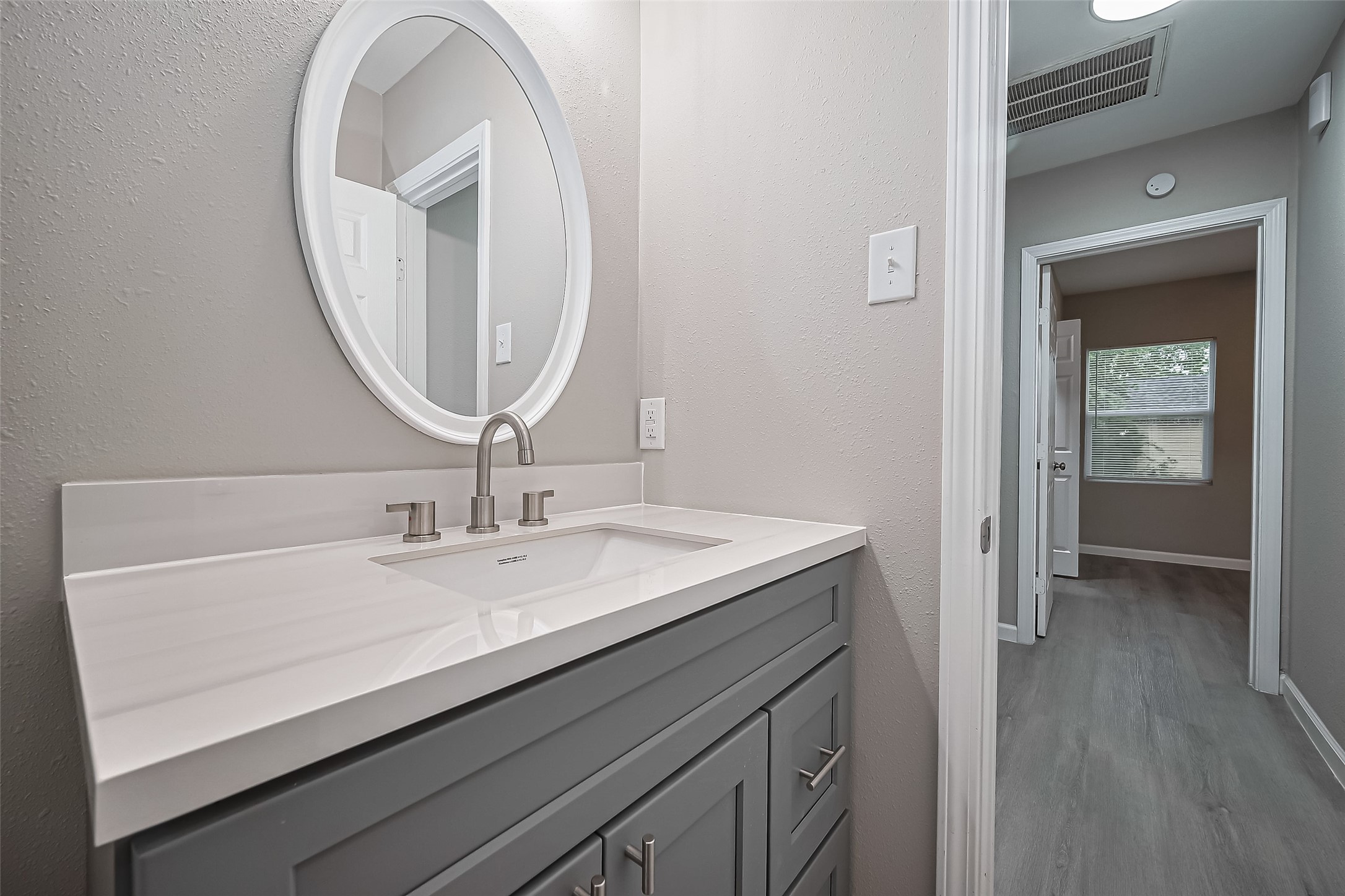 1739-17 West 5th Street Freeport, TX 77541 - Photo 20 of 26 a bathroom with a sink and a mirror