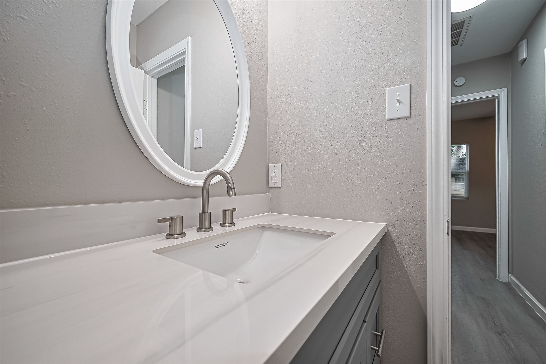 1739-17 West 5th Street Freeport, TX 77541 - Photo 21 of 26 a bathroom with a sink and a mirror