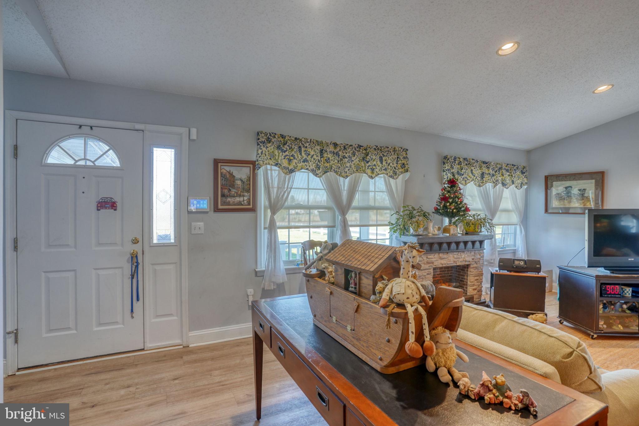 1406 Turkey Point Road Felton, DE 19943 - Photo 11 of 24 a view of a workspace with furniture and a window