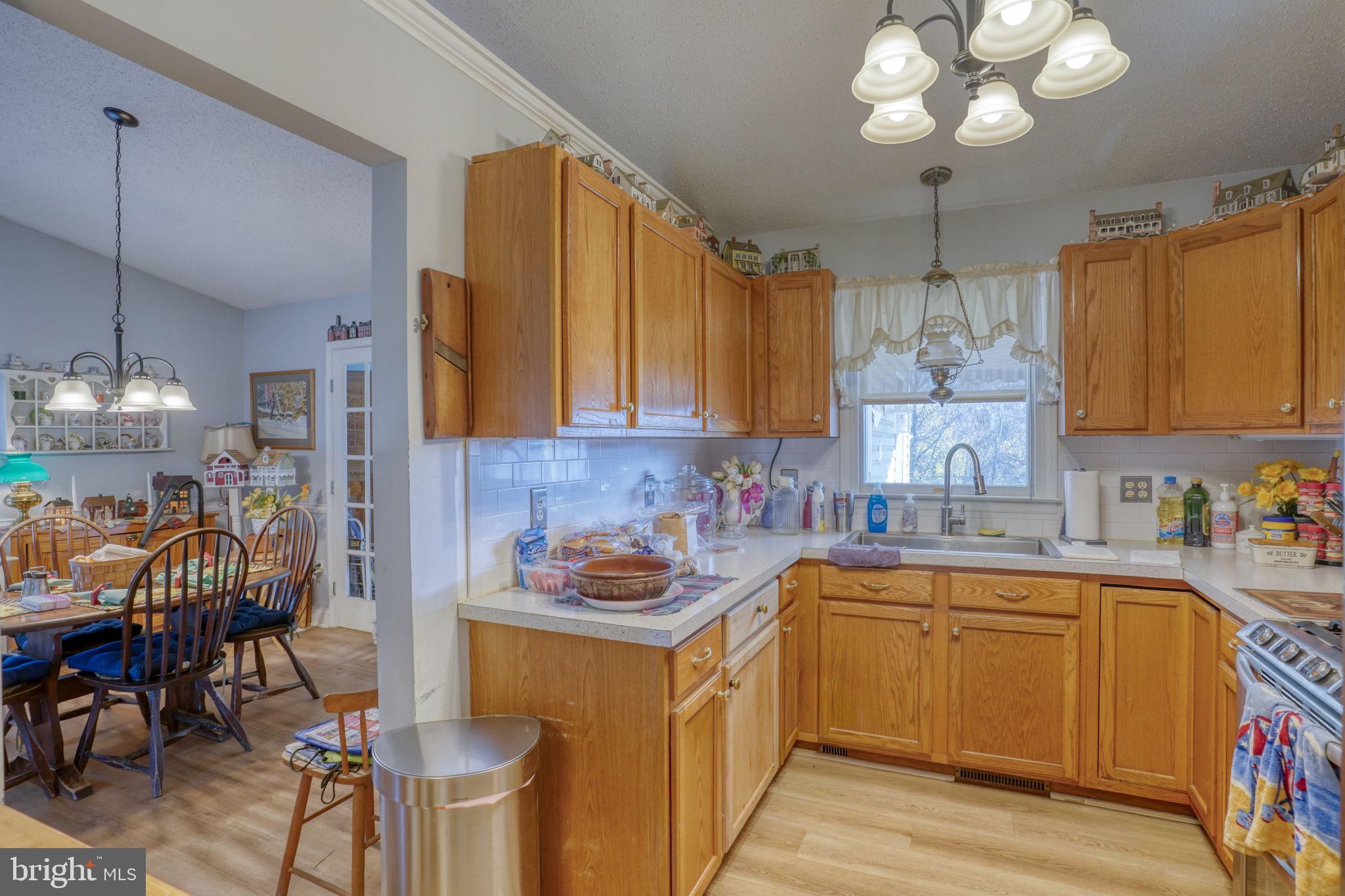 1406 Turkey Point Road Felton, DE 19943 - Photo 14 of 24 a kitchen with a sink cabinets and window