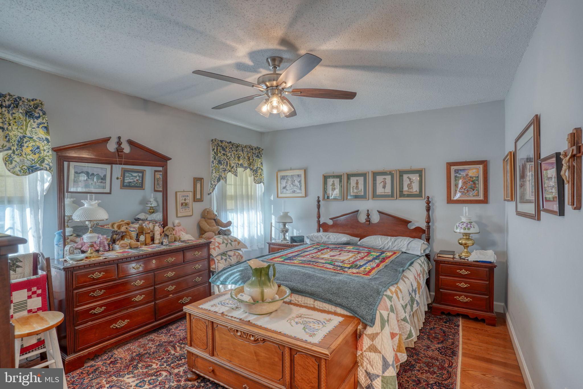 1406 Turkey Point Road Felton, DE 19943 - Photo 18 of 24 a bedroom with a bed and wooden floor