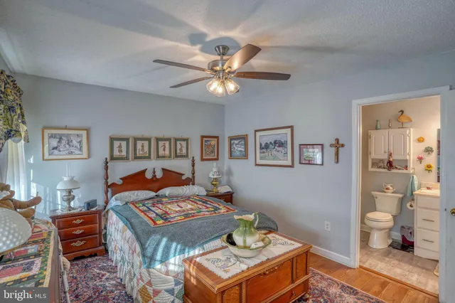 a living room with a bed and a table