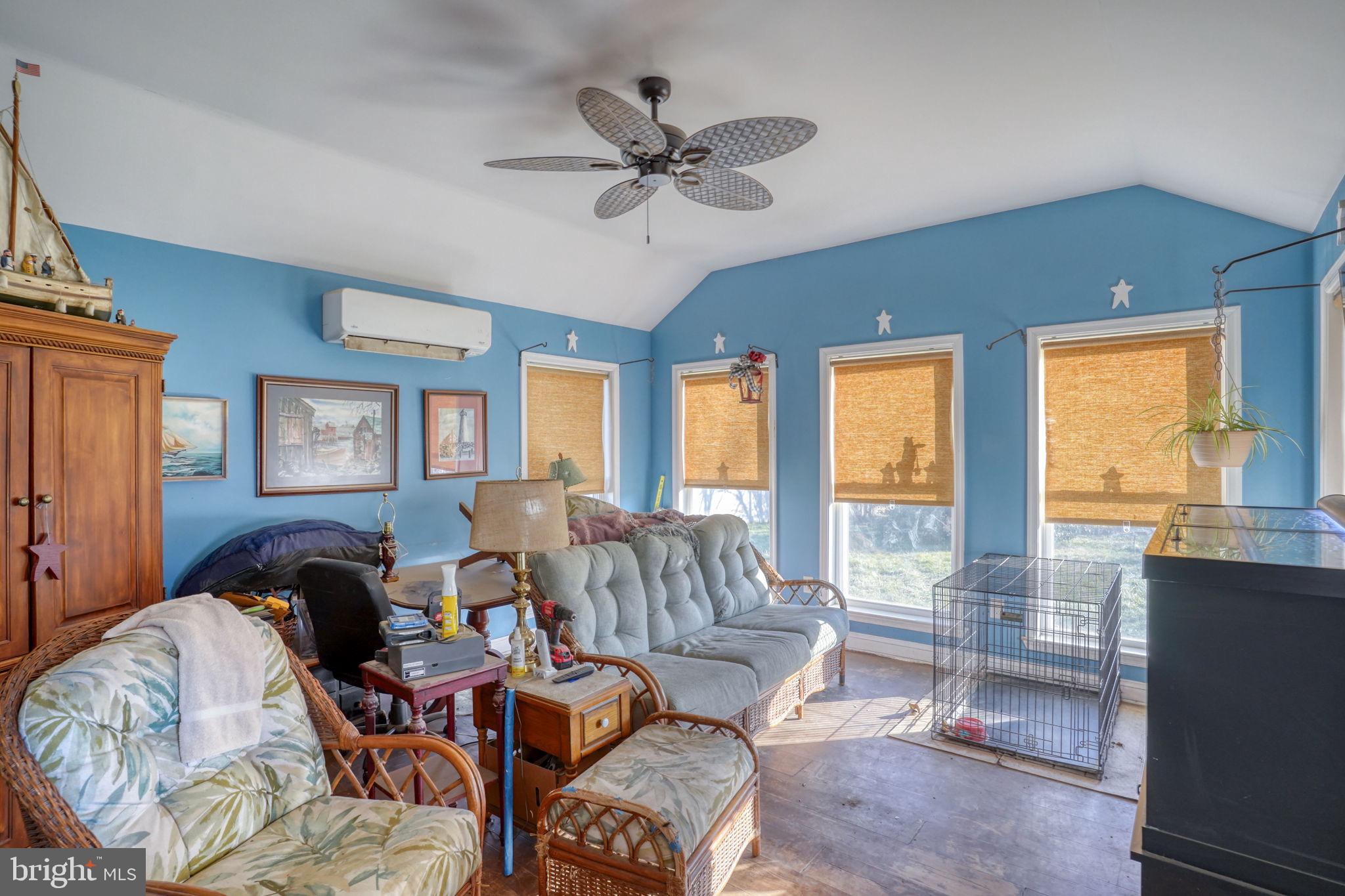 1406 Turkey Point Road Felton, DE 19943 - Photo 22 of 24 a living room with furniture and a large window