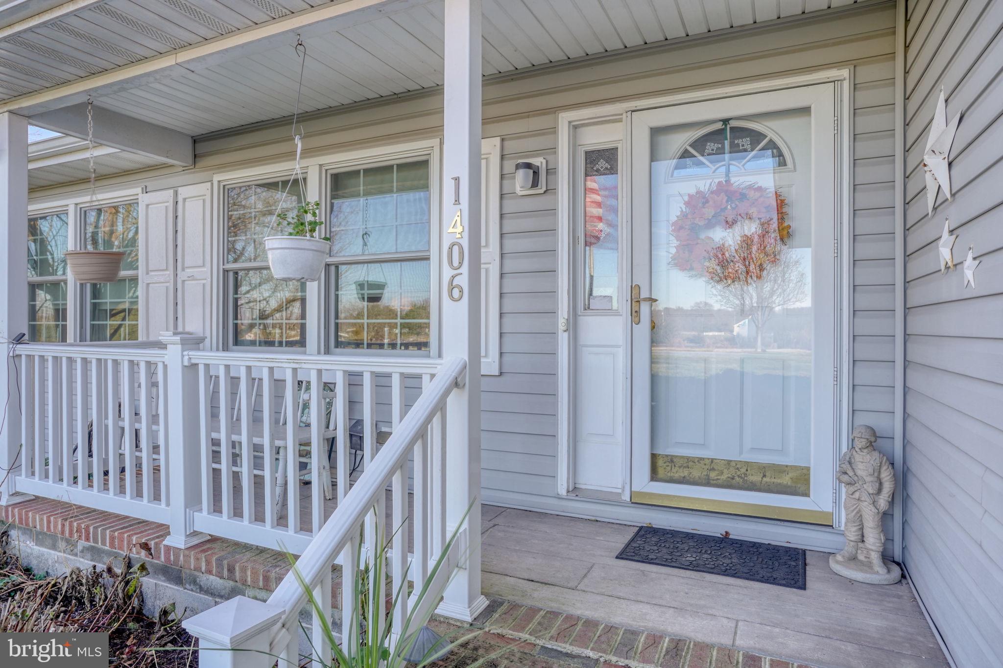 1406 Turkey Point Road Felton, DE 19943 - Photo 23 of 24 a view of a hallway with wooden floor and windows