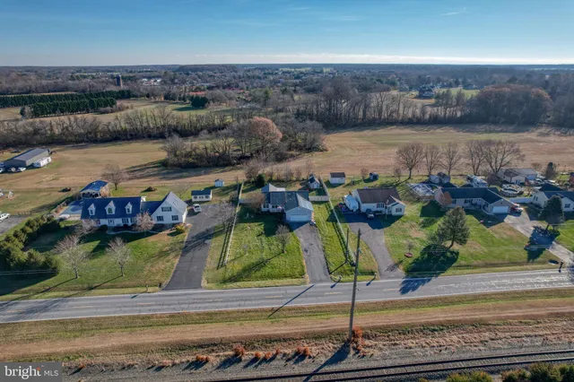 an aerial view of a house with a lake view