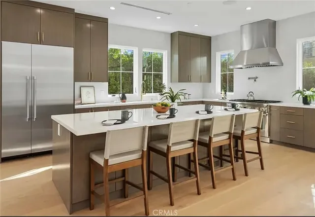 a kitchen with a table and chairs in it