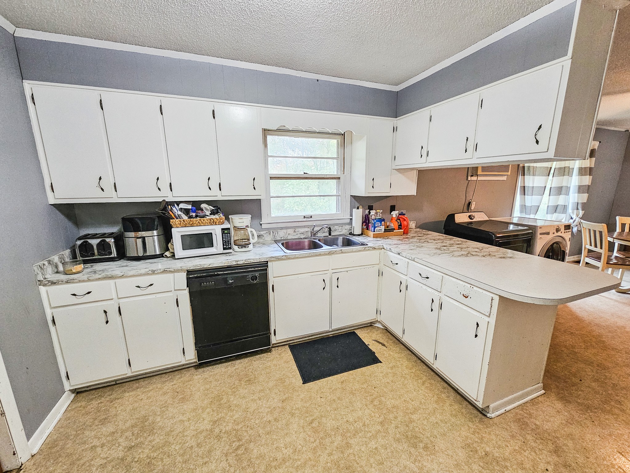 495 Salem Road Minor Hill, TN 38473 - Photo 13 of 30 a kitchen with cabinets appliances a sink and a window