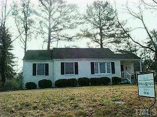2836 Claremont Road Raleigh, NC 27608 - Photo 1 of 1 a front view of a house with a yard