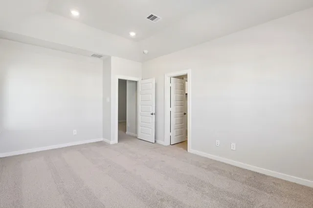 a bathroom with a double vanity sink toilet and shower