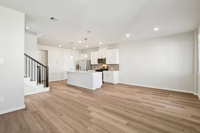 a view of kitchen with wooden floor