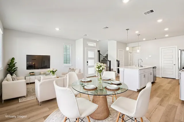 a view of a dining room with furniture