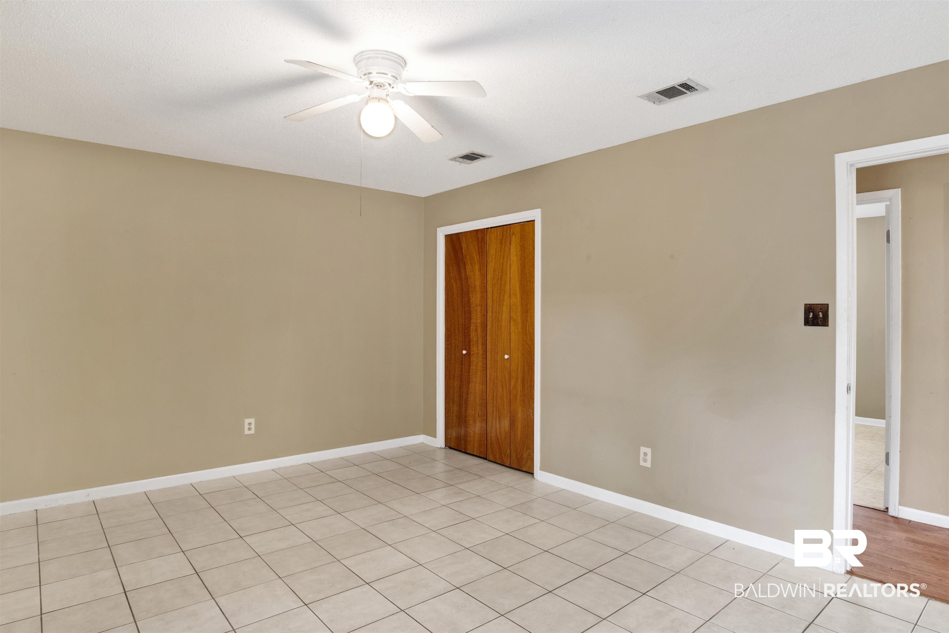 3560 Creekway Road Mobile, AL 36619 - Photo 14 of 24 Tiled empty room featuring ceiling fan