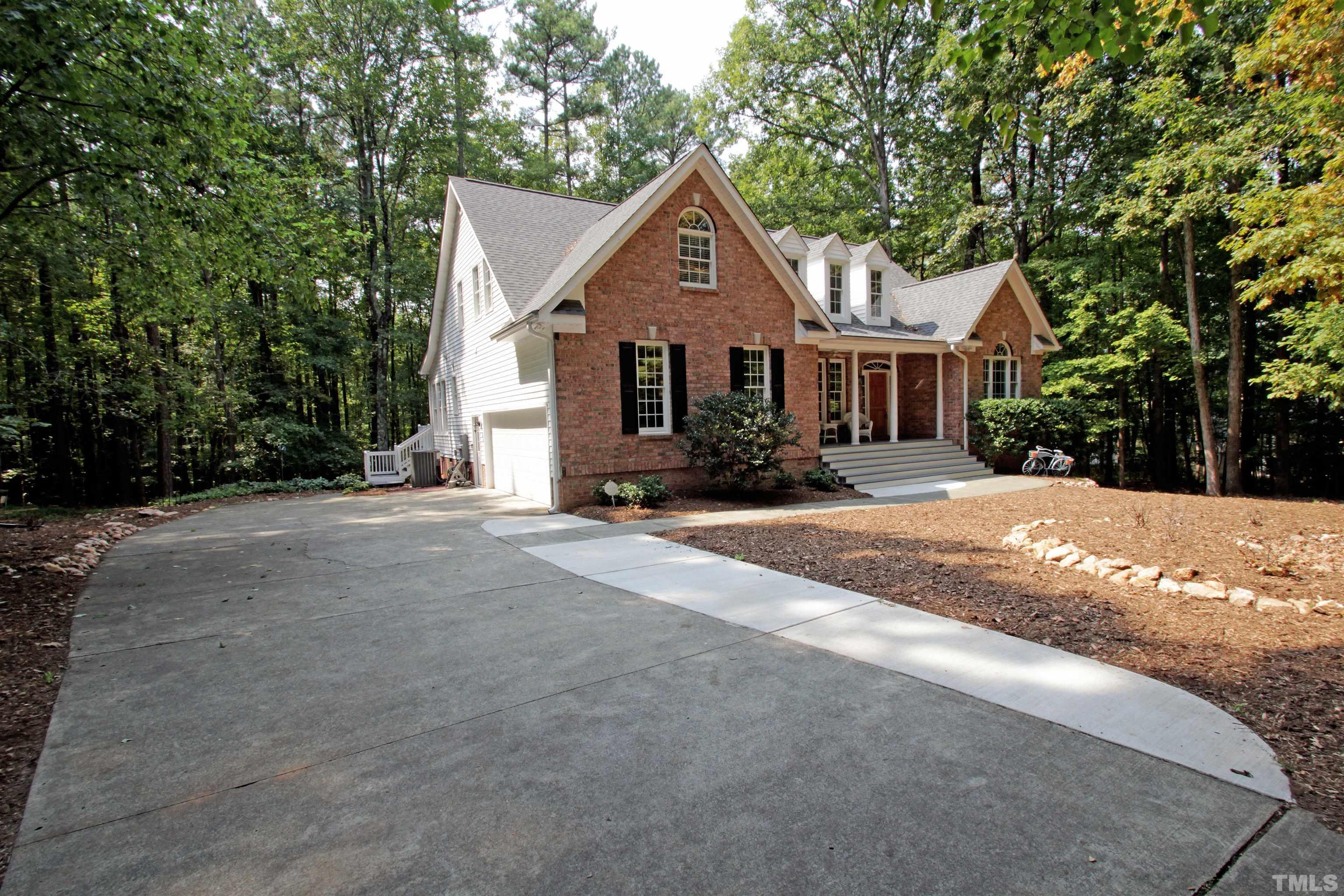 11817 Mountbatten Way Raleigh, NC 27613 - Photo 1 of 28 a front view of a house with a yard