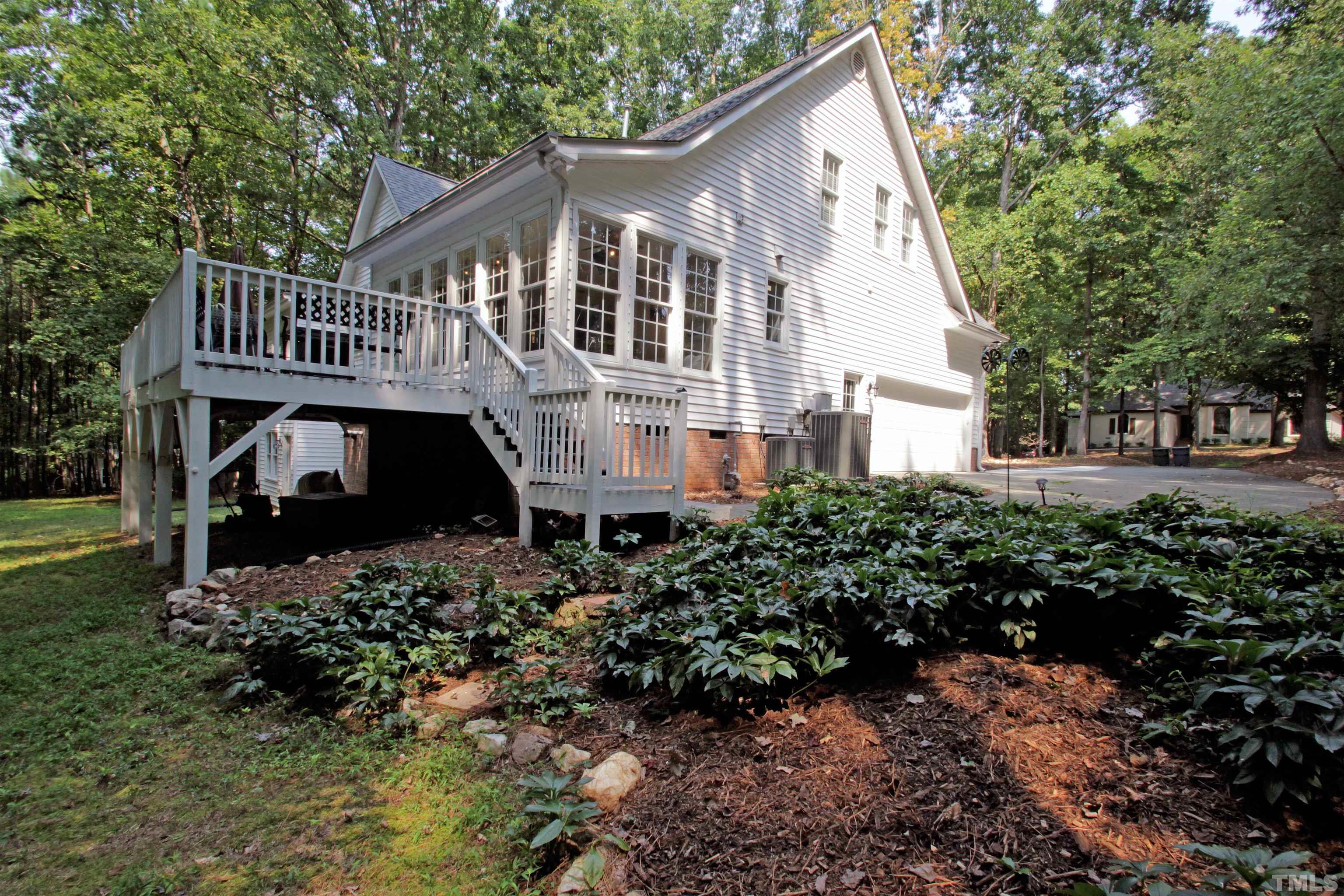 11817 Mountbatten Way Raleigh, NC 27613 - Photo 2 of 28 a front view of a house with a garden