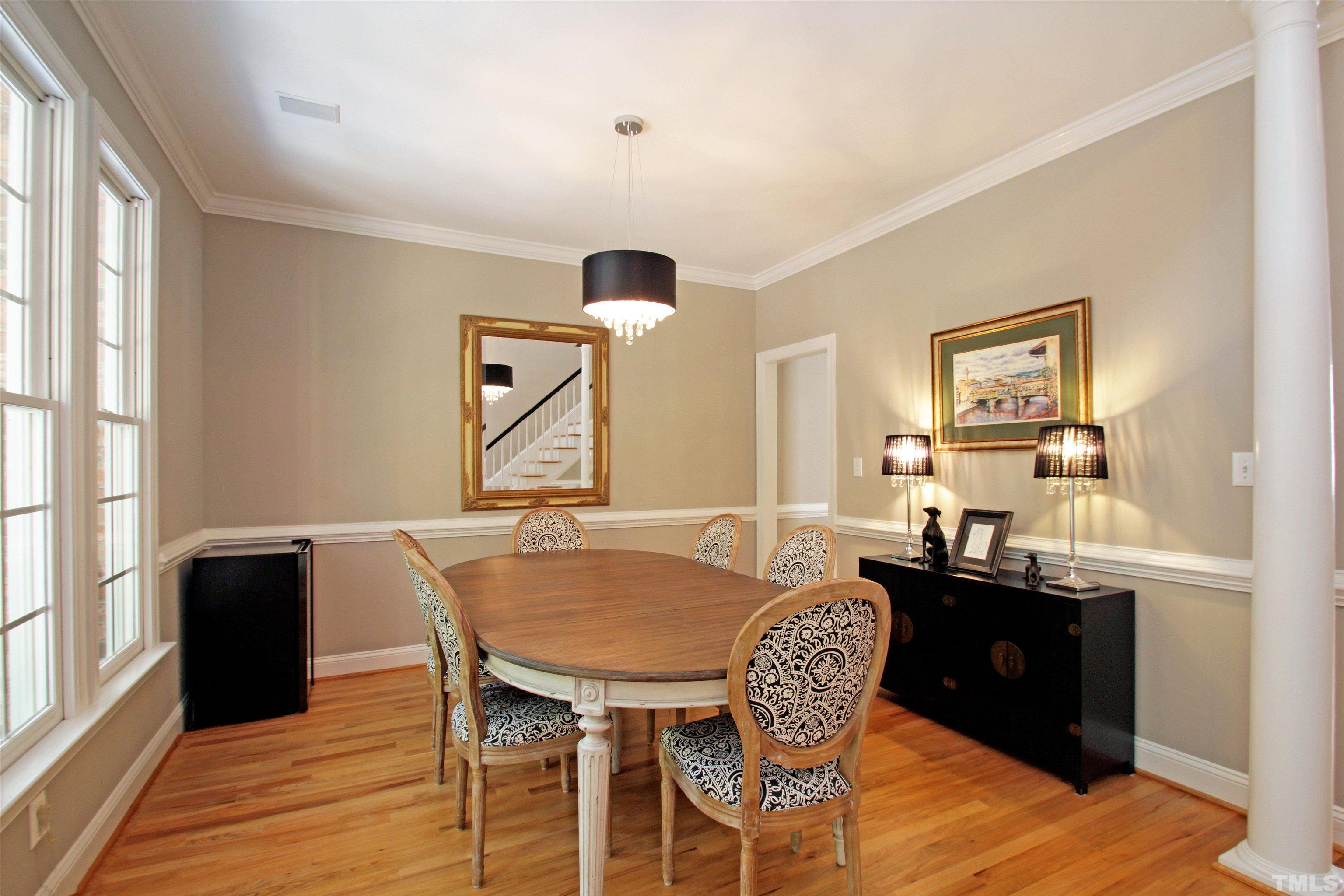 11817 Mountbatten Way Raleigh, NC 27613 - Photo 11 of 28 a view of a dining room with furniture window and wooden floor