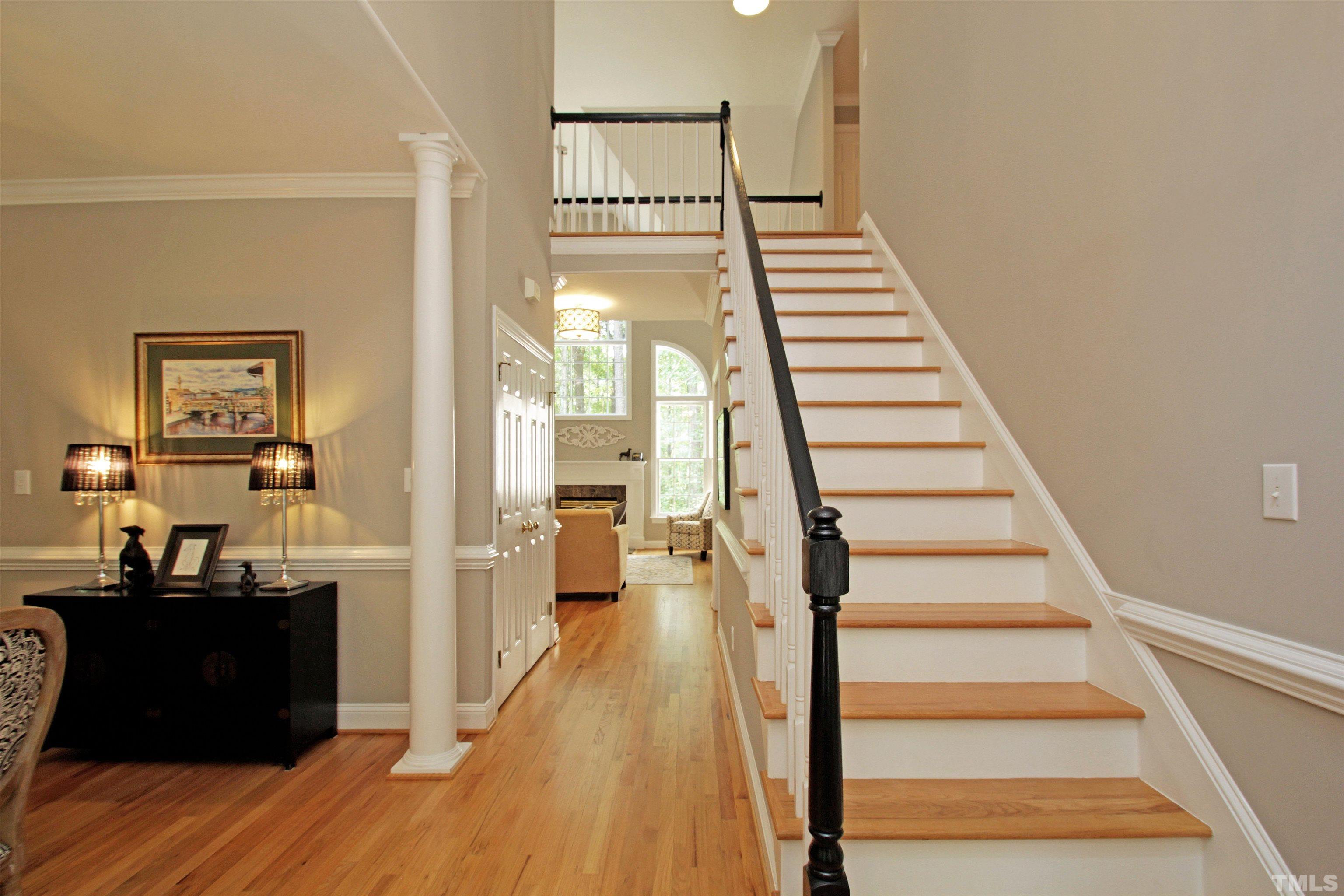 11817 Mountbatten Way Raleigh, NC 27613 - Photo 12 of 28 a view of a hallway with wooden floor and staircase