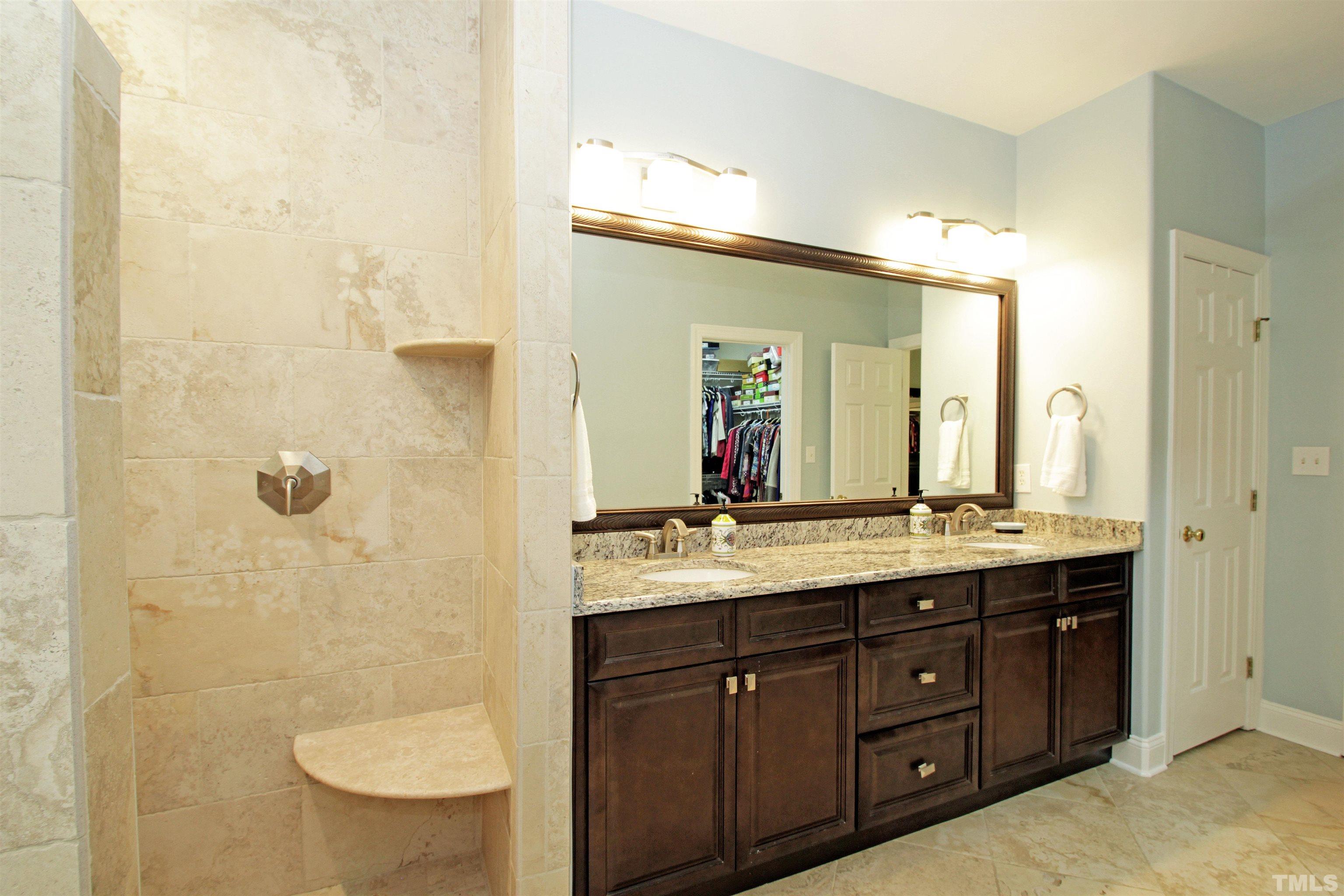11817 Mountbatten Way Raleigh, NC 27613 - Photo 15 of 28 a bathroom with a granite countertop sink toilet a mirror and shower