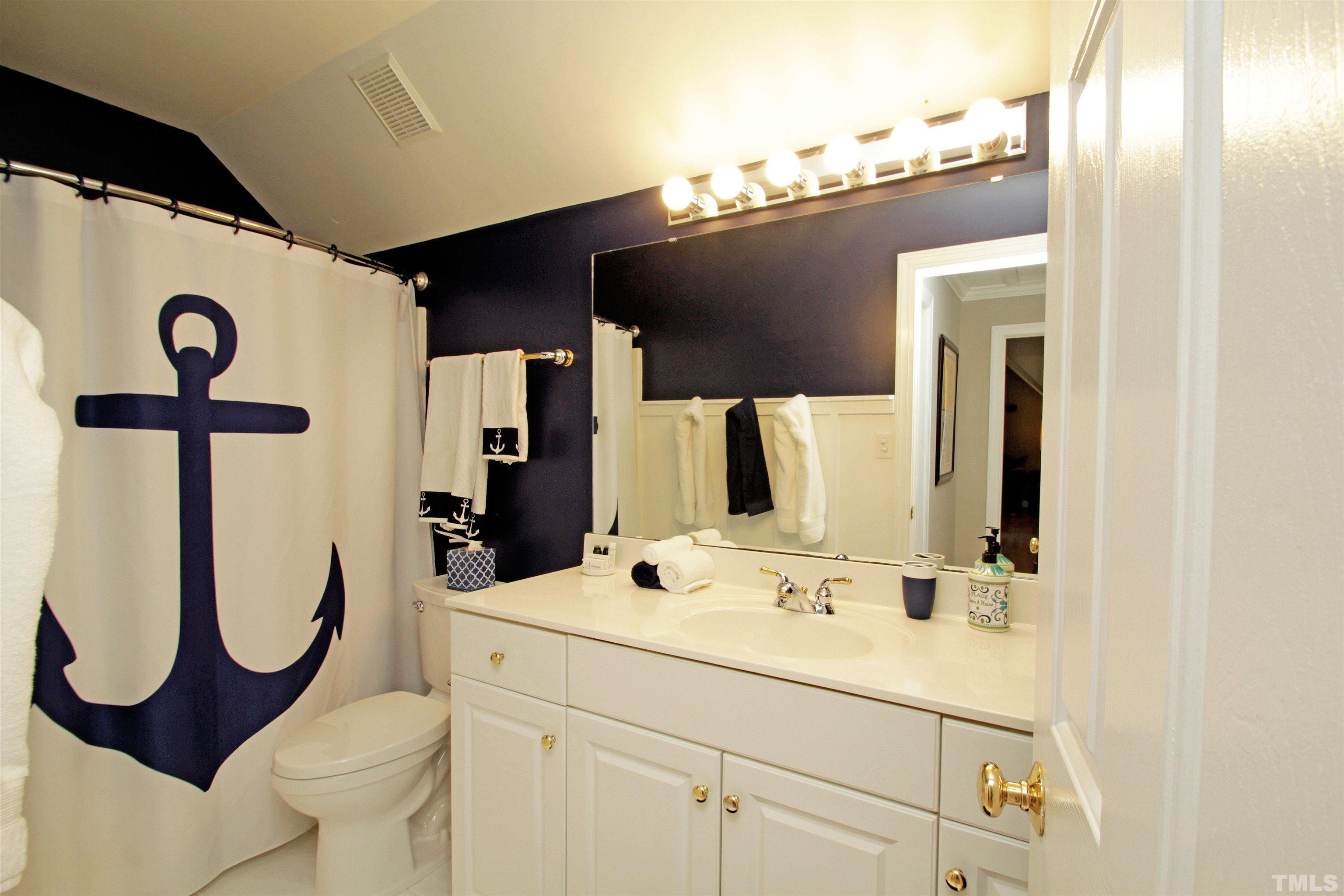 11817 Mountbatten Way Raleigh, NC 27613 - Photo 21 of 28 a bathroom with a sink and a mirror