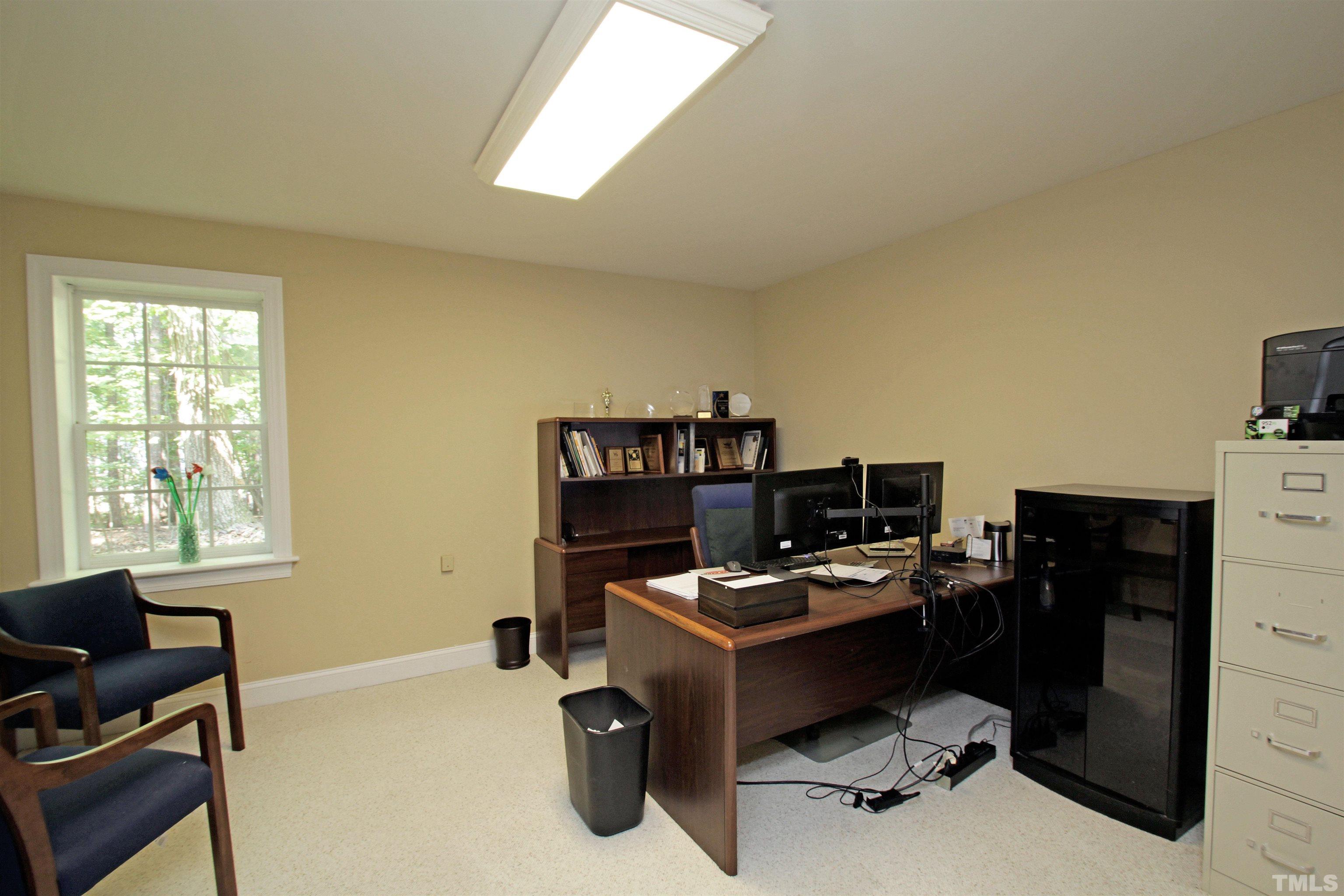11817 Mountbatten Way Raleigh, NC 27613 - Photo 25 of 28 a workspace with furniture and a window