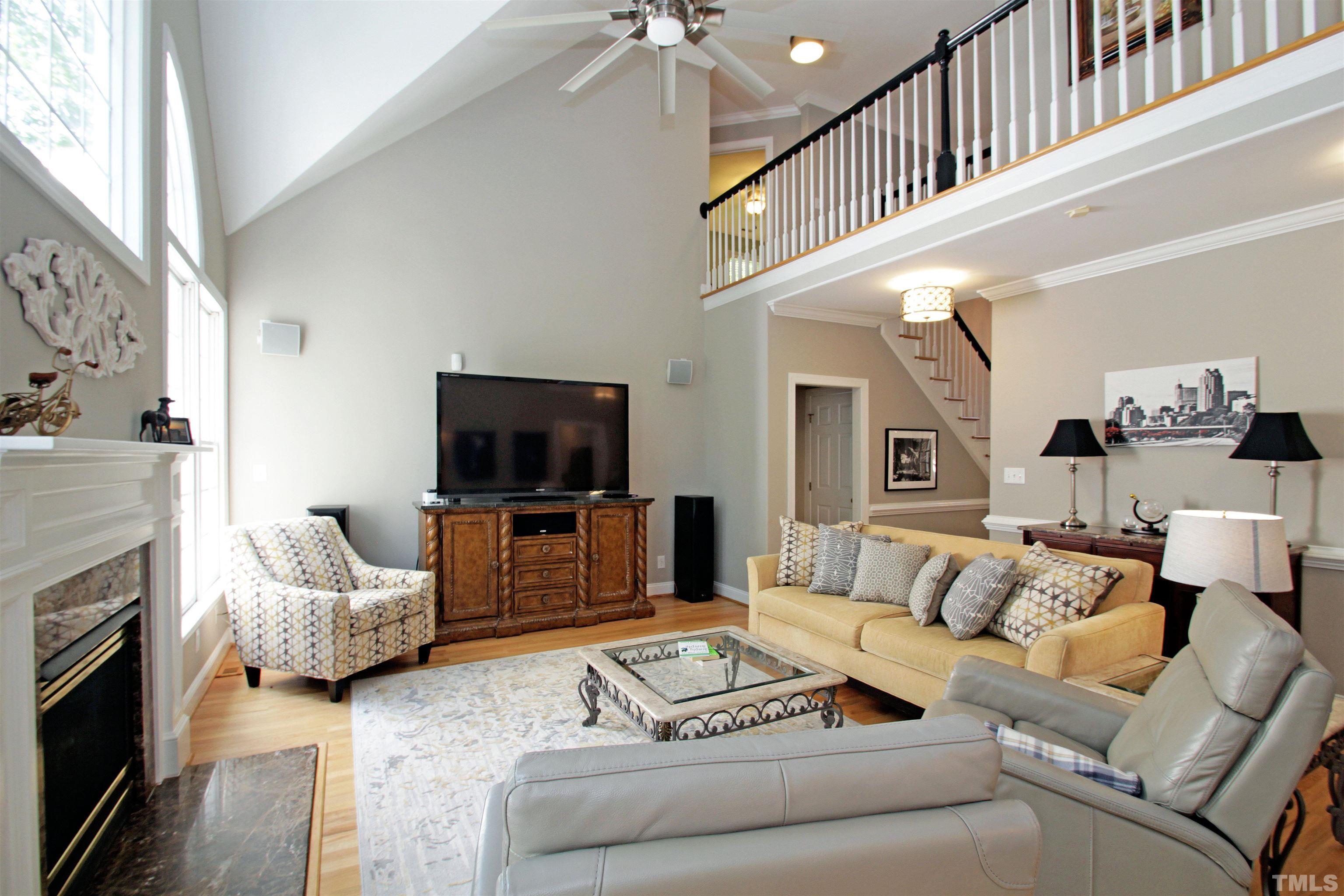 11817 Mountbatten Way Raleigh, NC 27613 - Photo 6 of 28 a living room with furniture and a flat screen tv