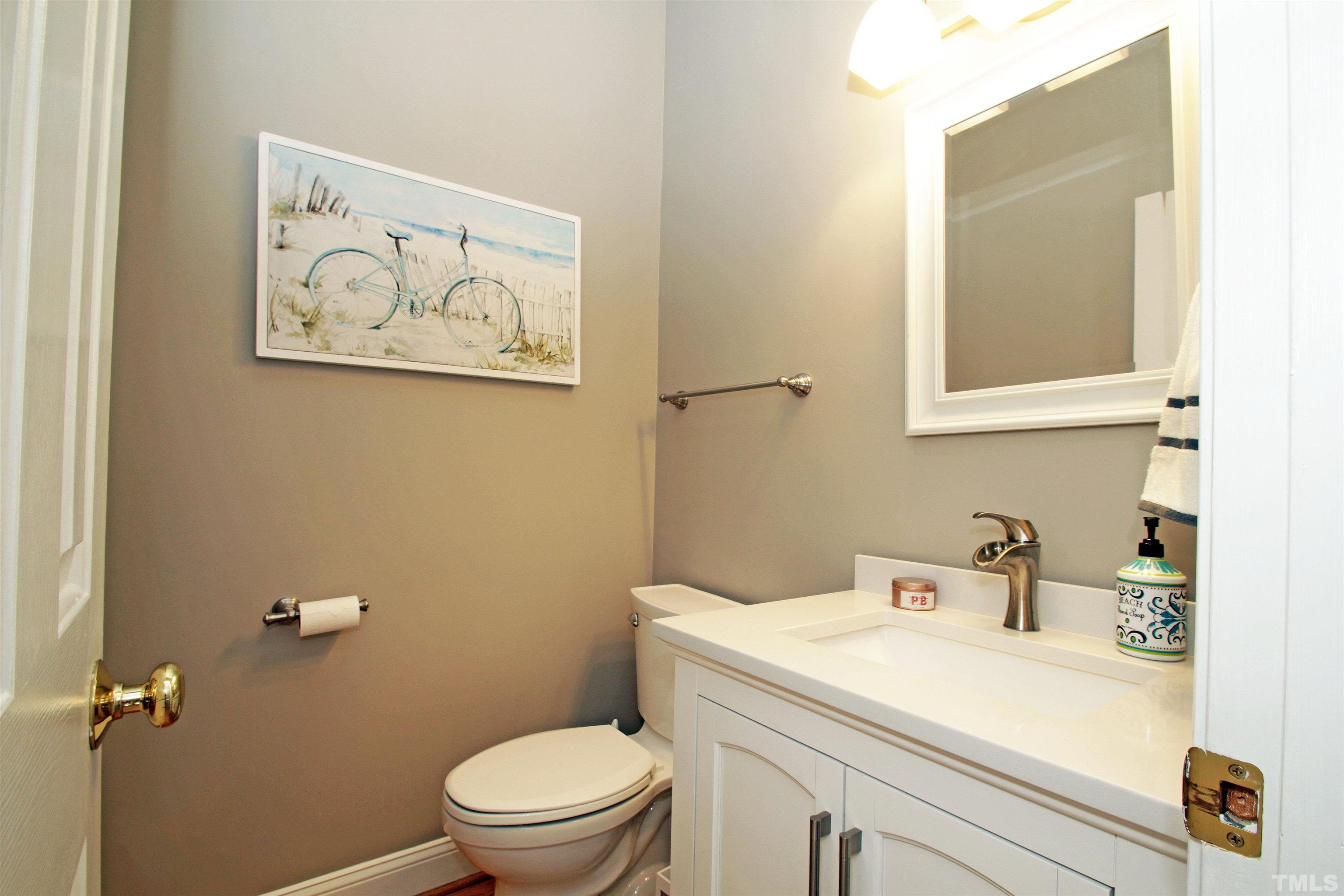 11817 Mountbatten Way Raleigh, NC 27613 - Photo 9 of 28 a bathroom with a toilet and a sink