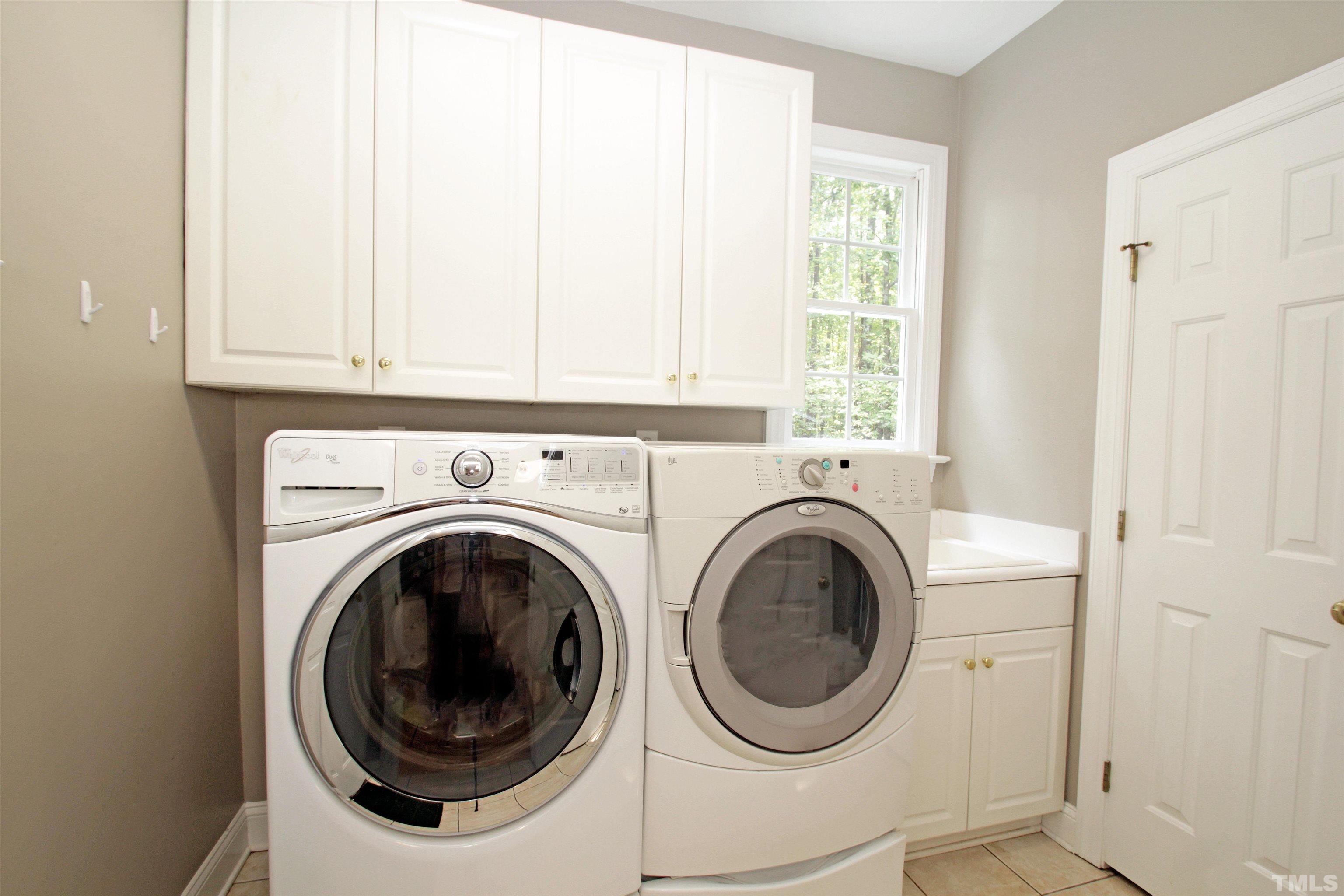 11817 Mountbatten Way Raleigh, NC 27613 - Photo 10 of 28 a utility room with dryer and washer