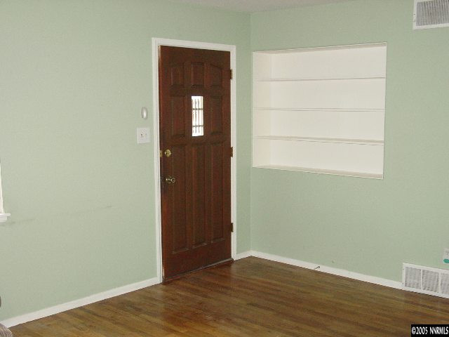 795 Bowman Drive Reno, NV 89503 - Photo 3 of 9 an empty room with wooden floor and closet