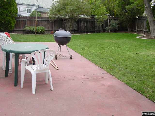 795 Bowman Drive Reno, NV 89503 - Photo 6 of 9 a view of a chair and table in backyard of the house