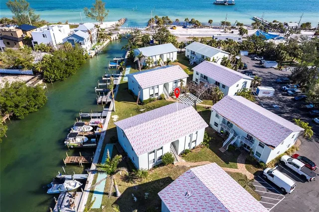 an aerial view of a houses with outdoor space