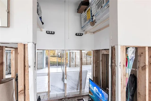 a view of a lake with boats and trees in the background