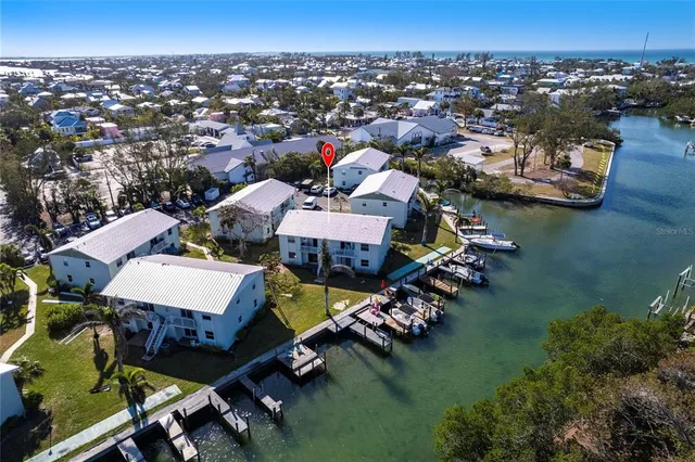 an aerial view of a house with a lake view