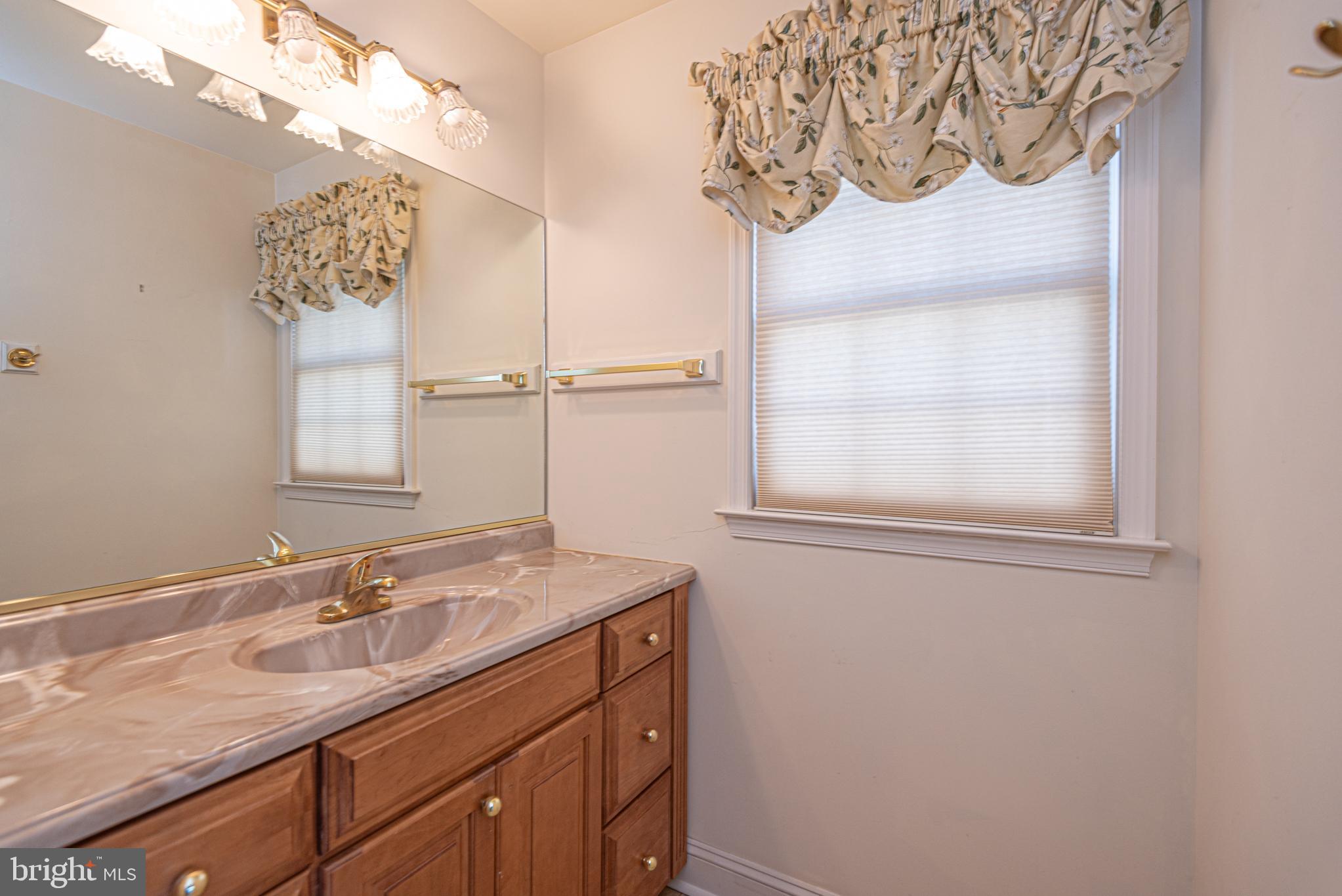 6023 Tarry Town Road Salisbury, MD 21801 - Photo 31 of 61 Bright and inviting bathroom with classic charm.