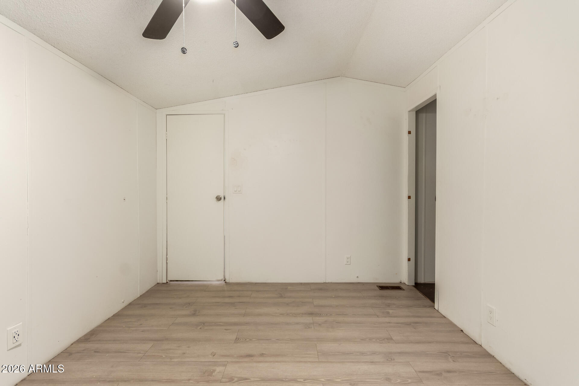 54194 West Organ Pipe Road Maricopa, AZ 85139 - Photo 21 of 52 a view of an empty room with wooden floor