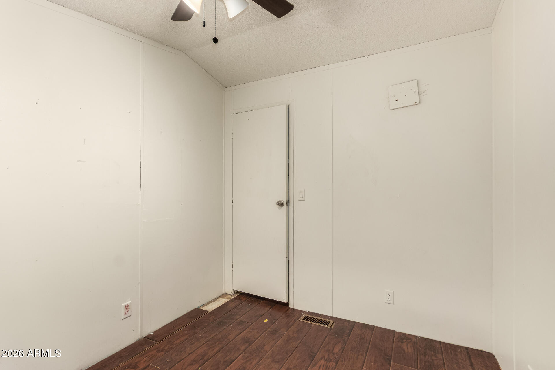 54194 West Organ Pipe Road Maricopa, AZ 85139 - Photo 24 of 52 a view of an empty room with wooden floor