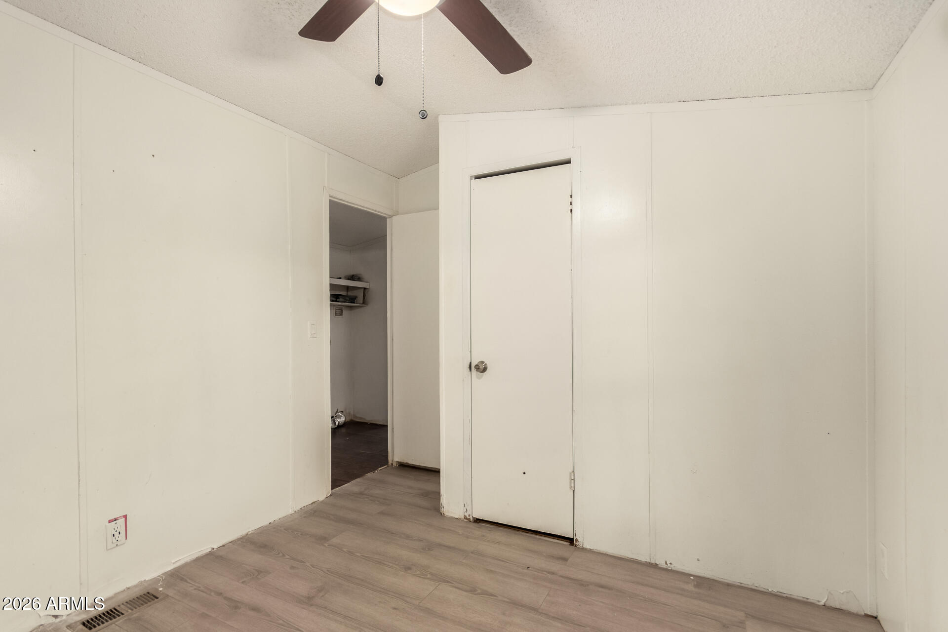 54194 West Organ Pipe Road Maricopa, AZ 85139 - Photo 26 of 52 a view of an empty room with wooden floor
