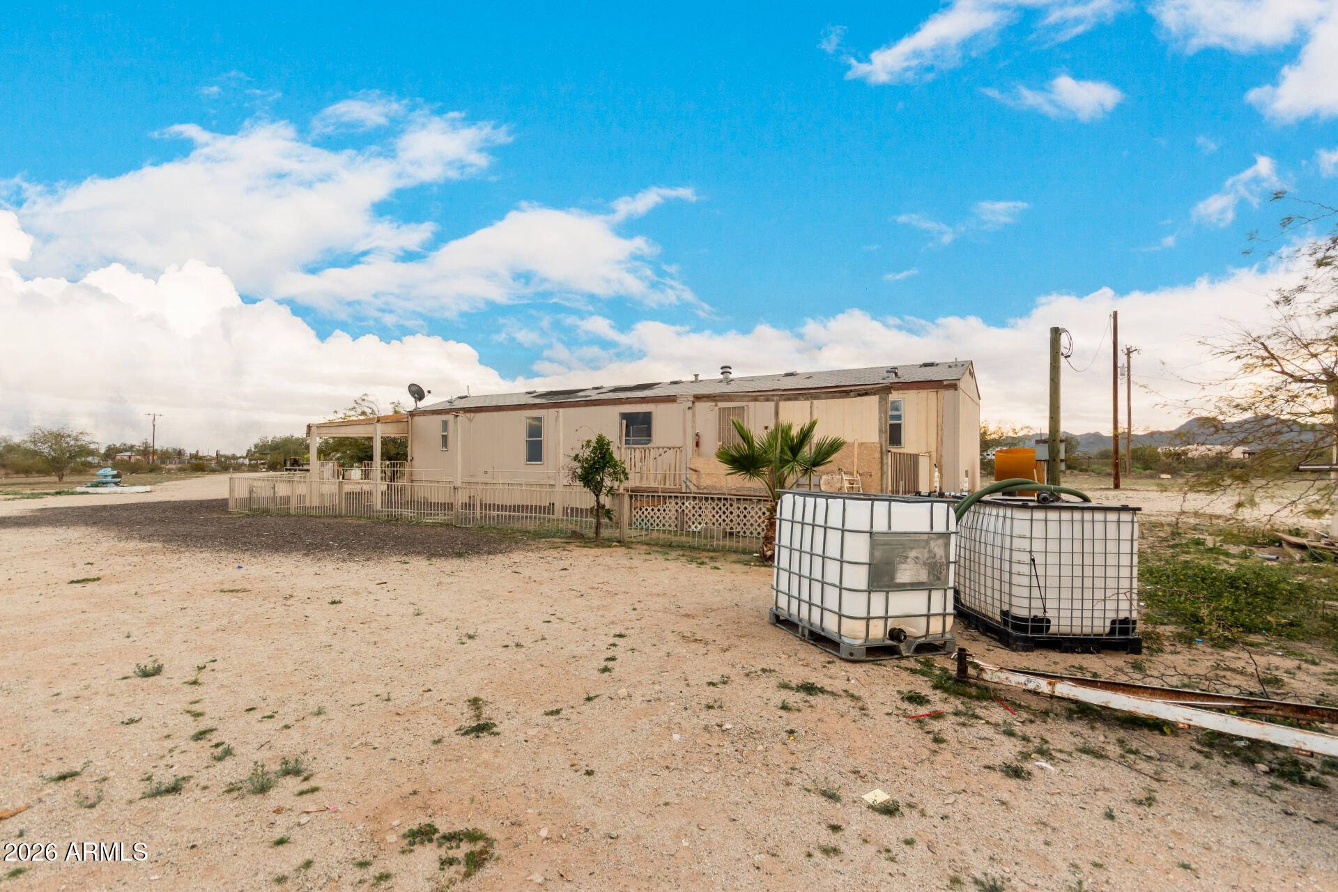 54194 West Organ Pipe Road Maricopa, AZ 85139 - Photo 35 of 52 a view of a dry yard with wooden fence