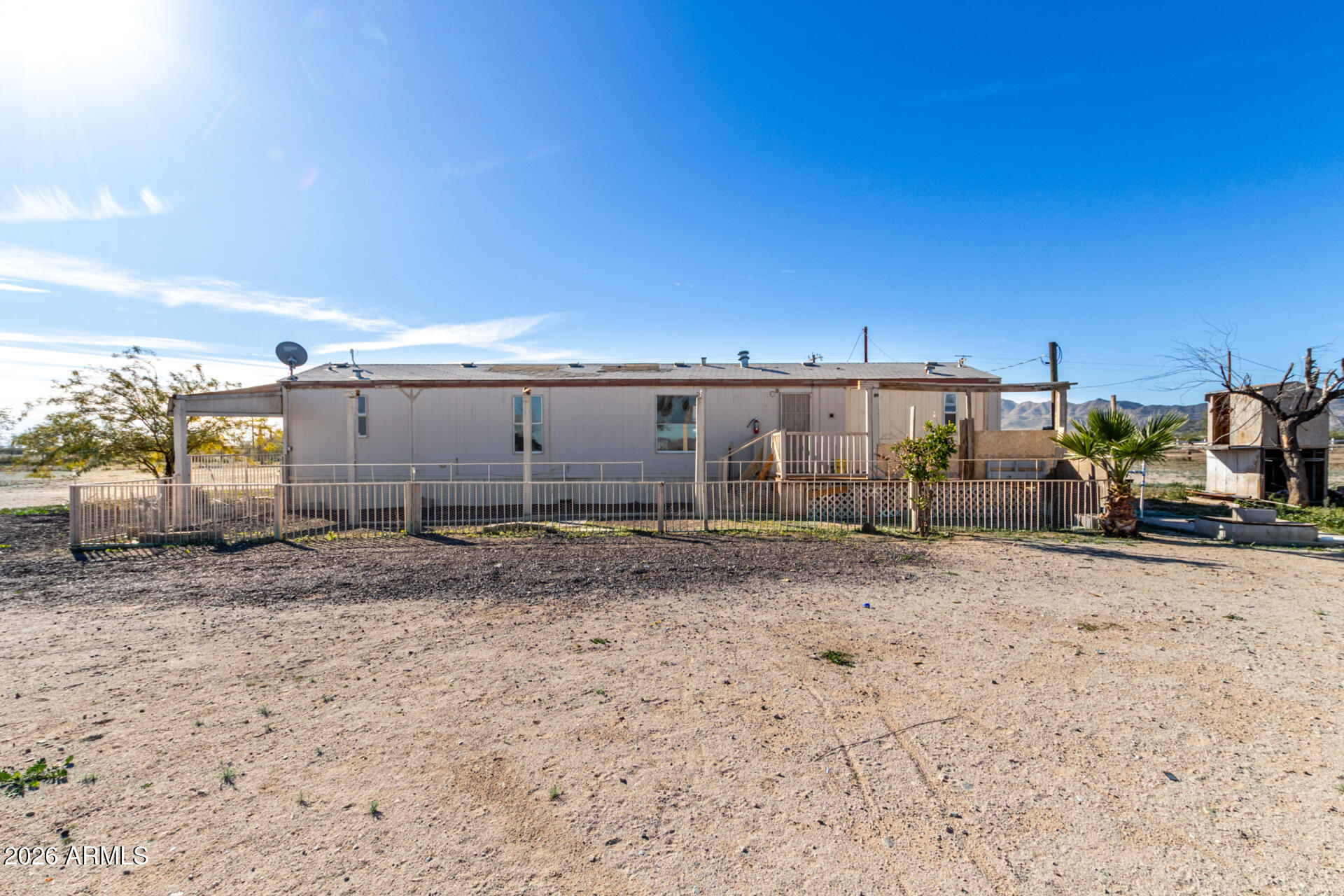 54194 West Organ Pipe Road Maricopa, AZ 85139 - Photo 37 of 52 a view of a dry yard with wooden fence