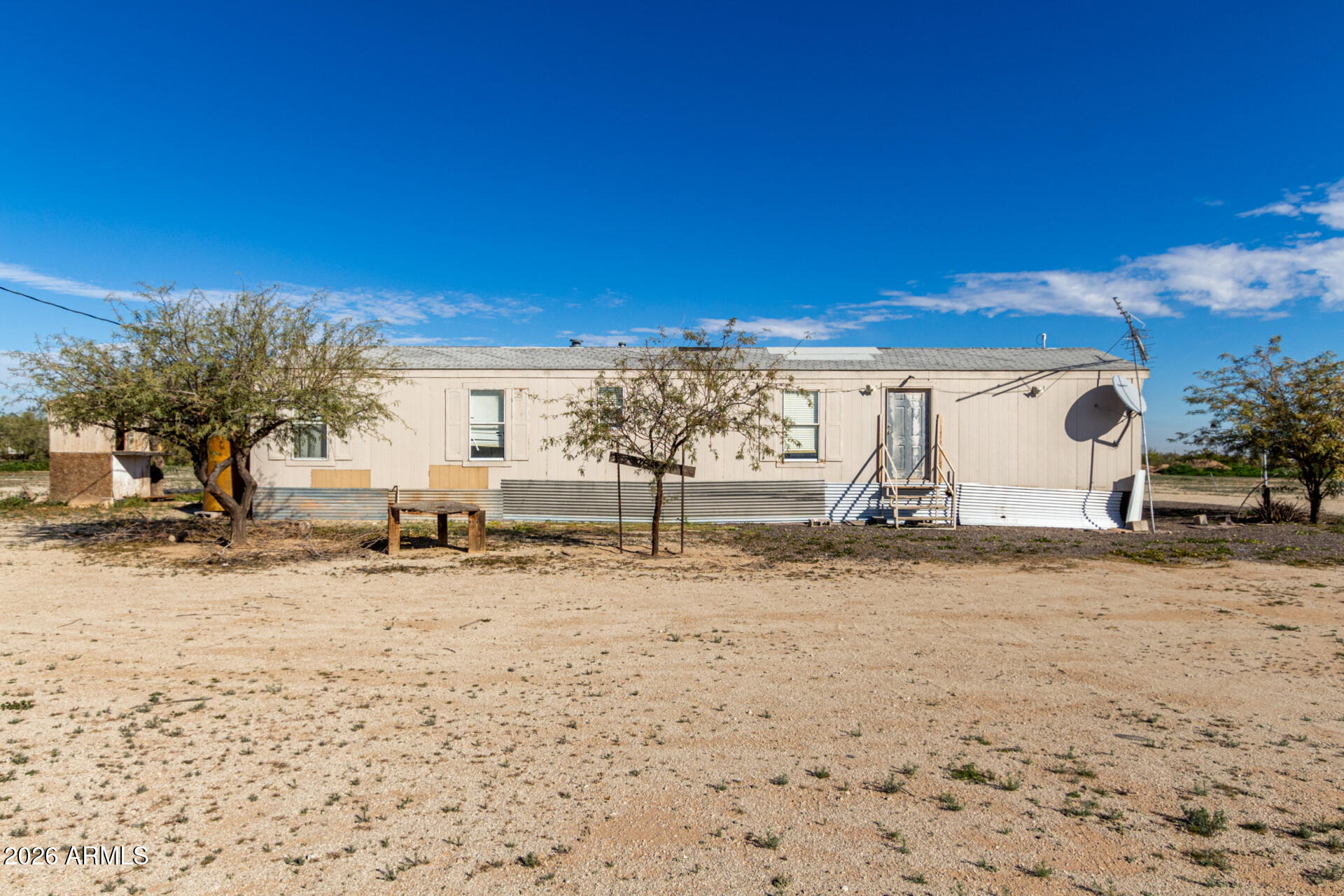 54194 West Organ Pipe Road Maricopa, AZ 85139 - Photo 6 of 52 a view of a dirt road and building