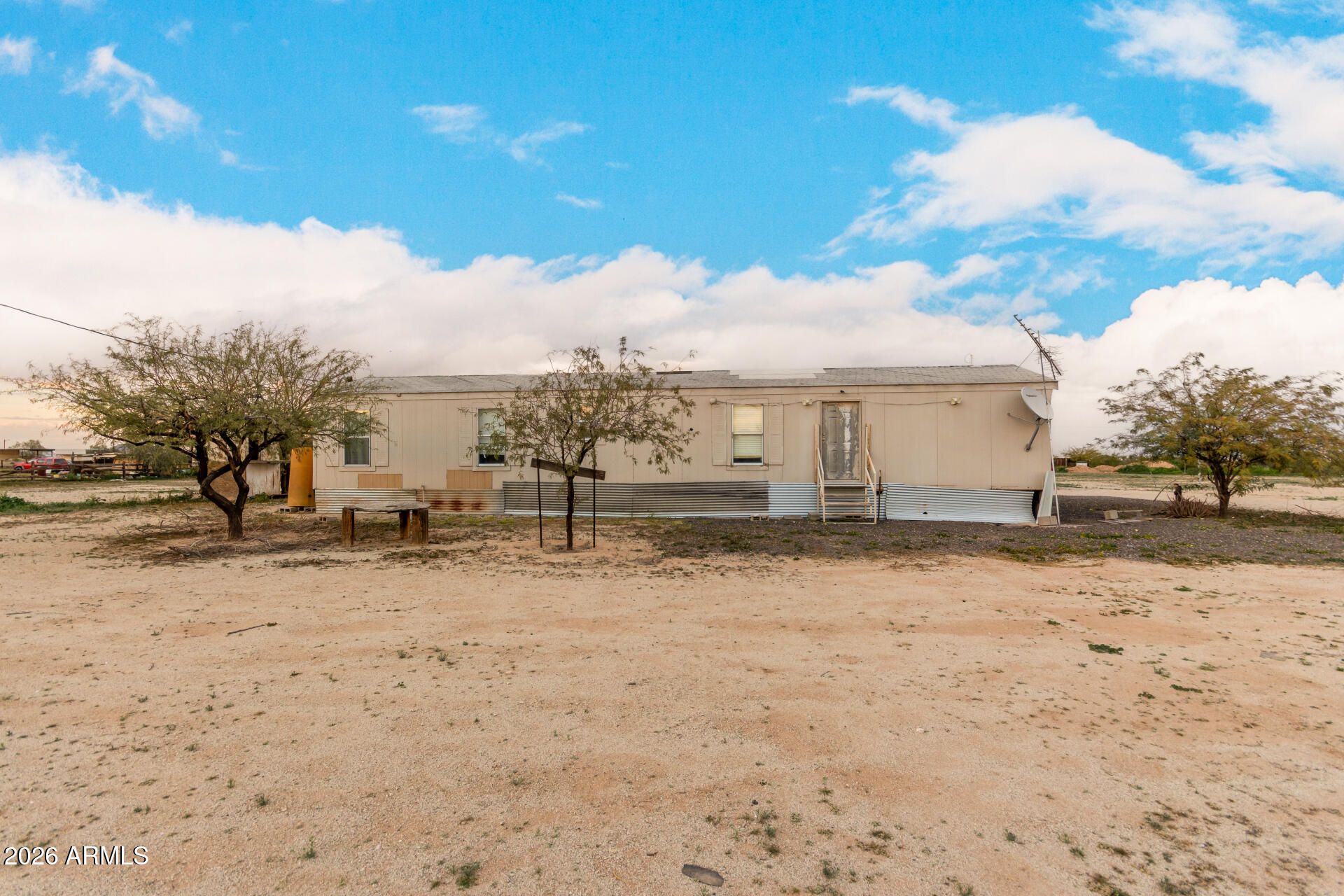54194 West Organ Pipe Road Maricopa, AZ 85139 - Photo 7 of 52 a view of a yard covered in snow