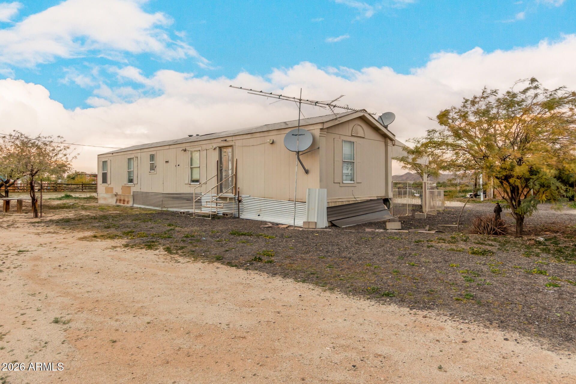 54194 West Organ Pipe Road Maricopa, AZ 85139 - Photo 10 of 52 a view of a blue house with a yard