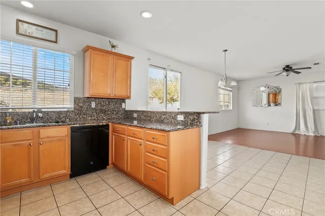 an empty room with closet and windows